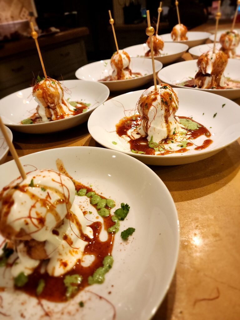 Plates of creamy chaat drizzled with sauces
