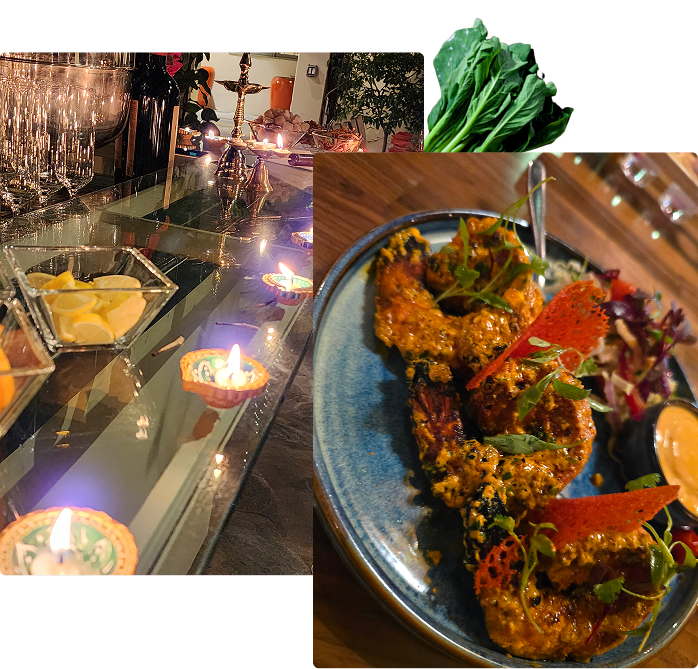Festive table with diyas and spiced prawns